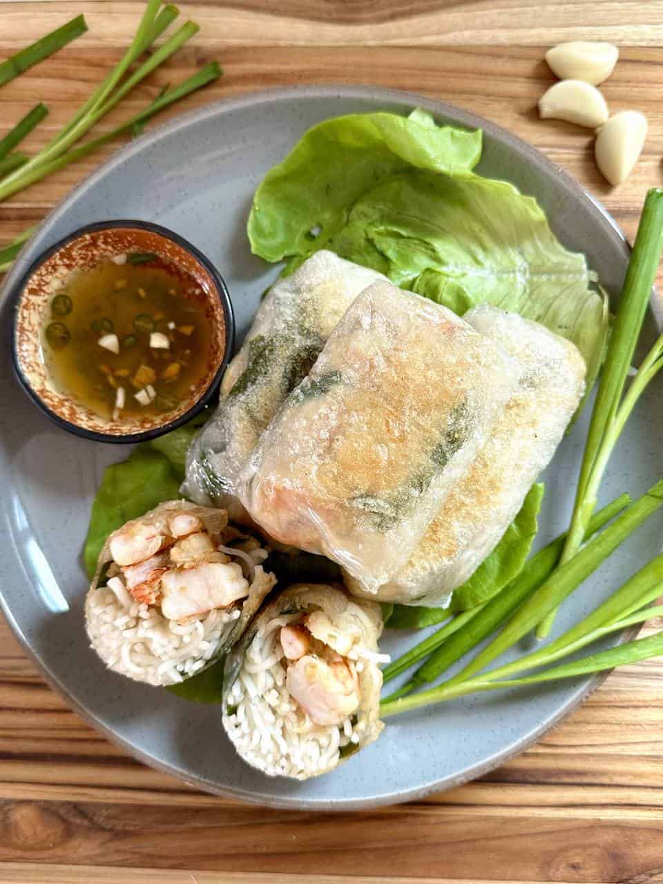 Lemongrass shrimp in crispy rice paper on top of a butter lettuce leaf