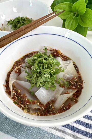 Rice paper noodles in a bowl of soy chili oil