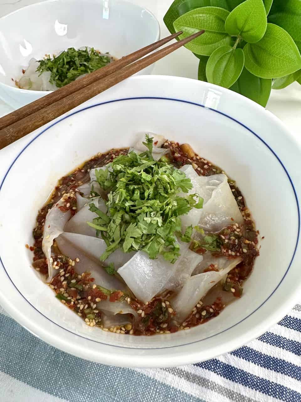 Rice paper noodles in a bowl of soy chili oil