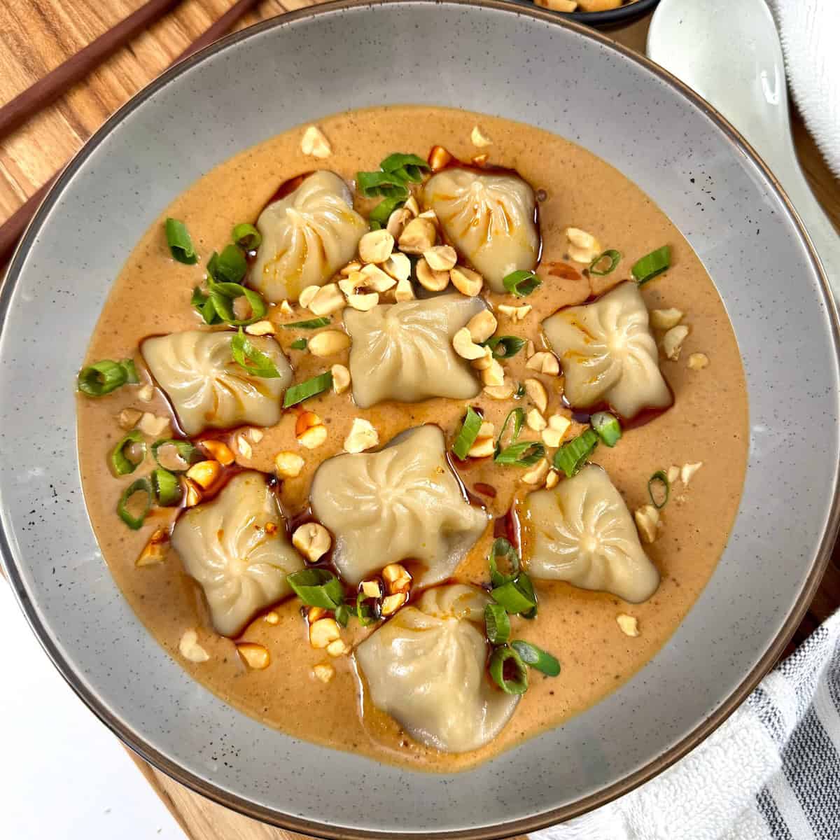 Soup Dumplings with Spicy Peanut Sauce - Featured