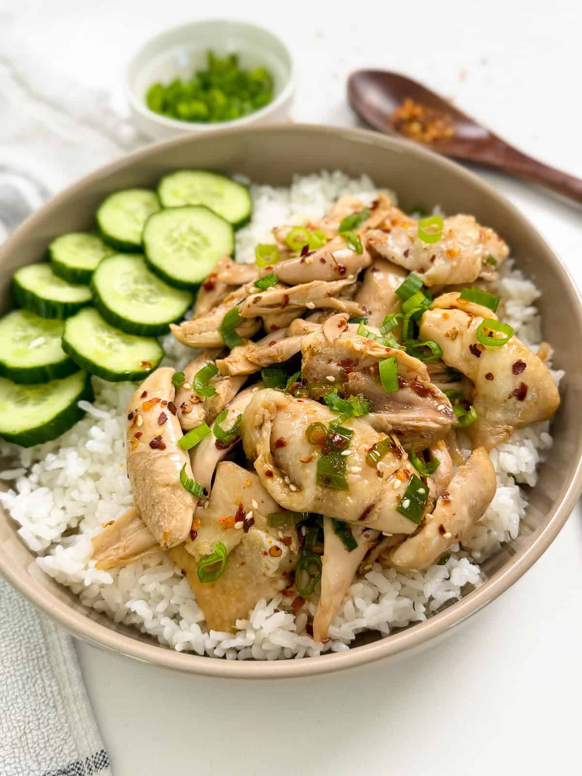 Poached Chicken with Soy Chili Oil with a bowl of white rice front view