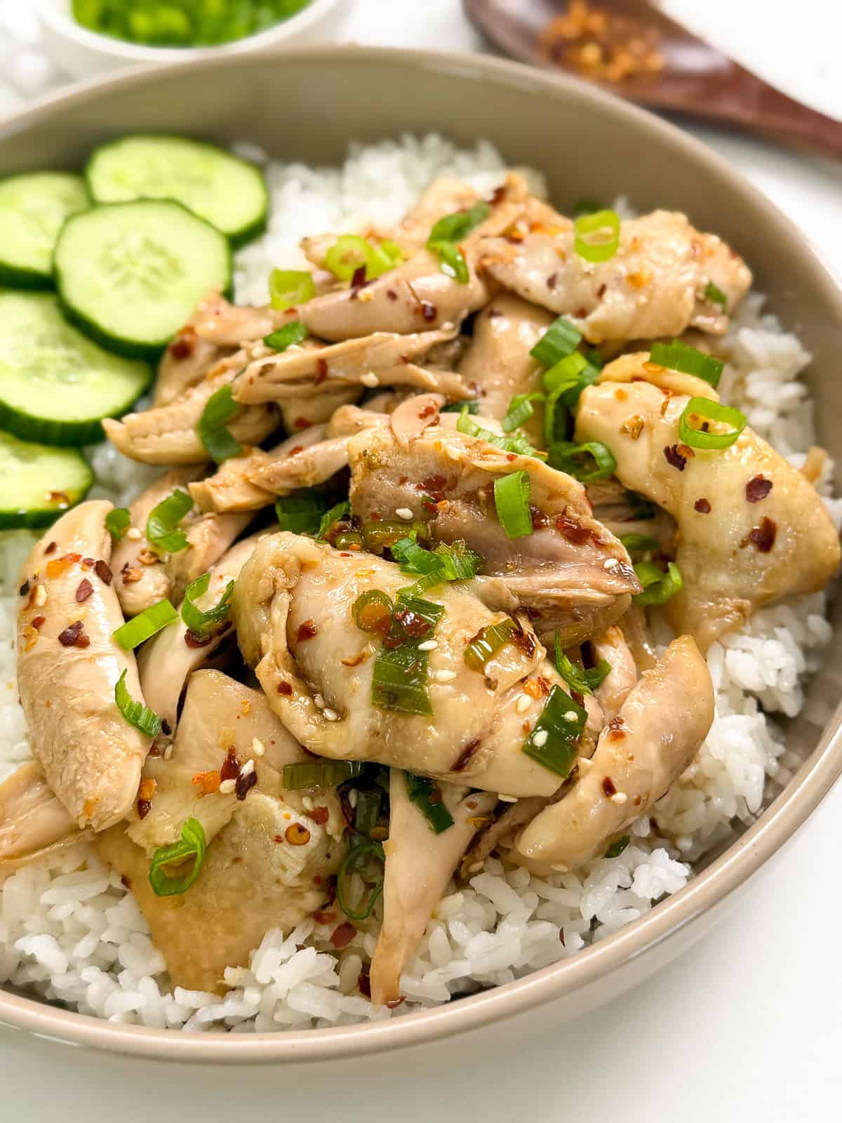 Poached Chicken with Soy Chili Oil with a bowl of white rice side view