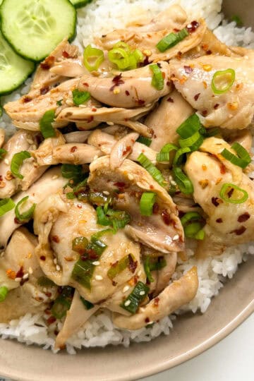Poached Chicken with Soy Chili Oil with a bowl of white rice featured view