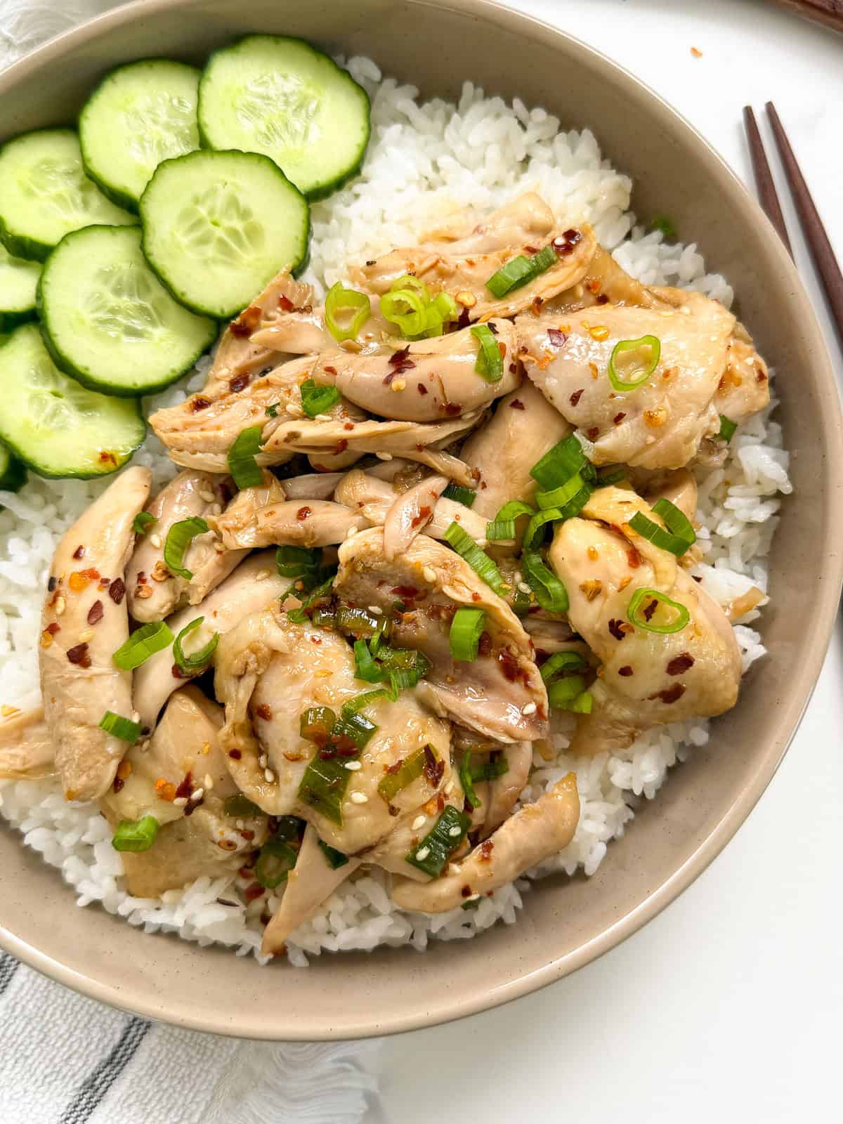 Poached Chicken with Soy Chili Oil with a bowl of white rice main view