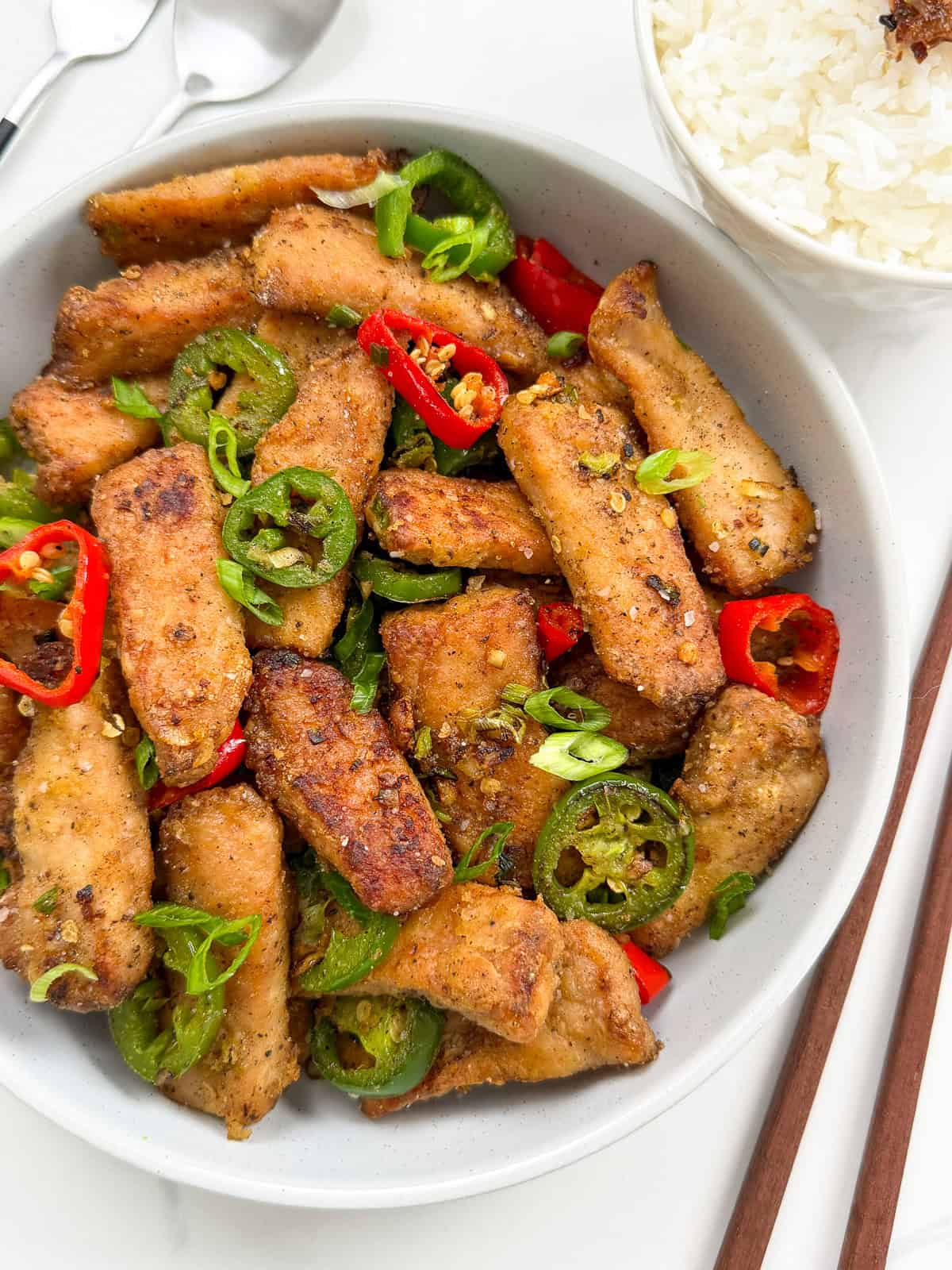 Salt and Pepper Pork Chops on a plate side angle