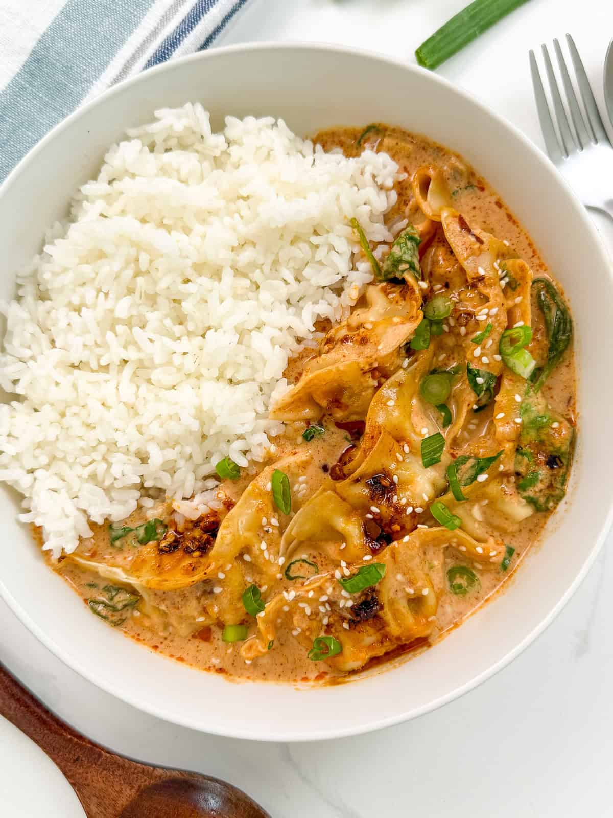 Dumpling Bake (Viral One Pan Recipe) in a bowl with sauce top view