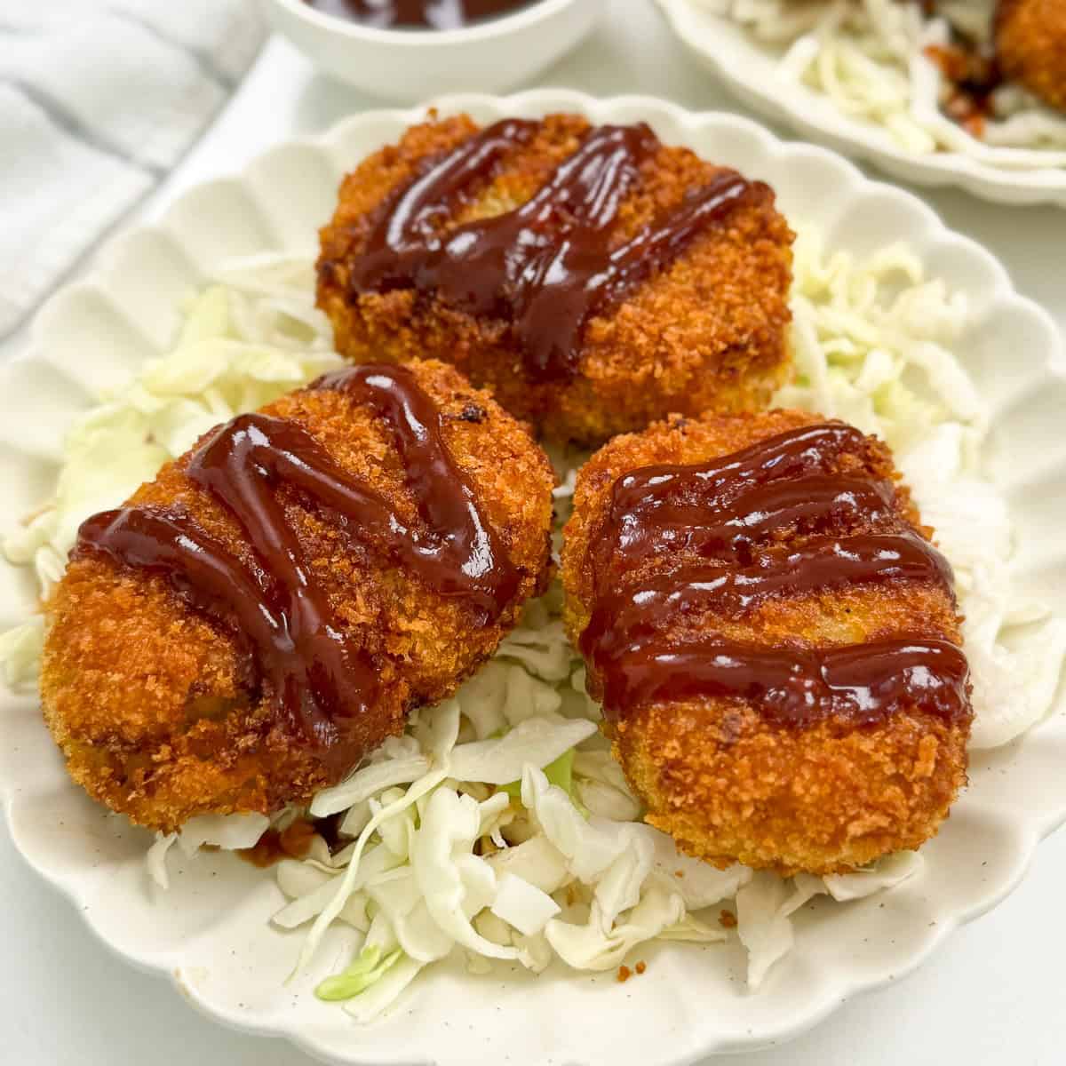 Japanese Sweet Potato Croquettes (Satsumaimo Korokke) three on a plate side view
