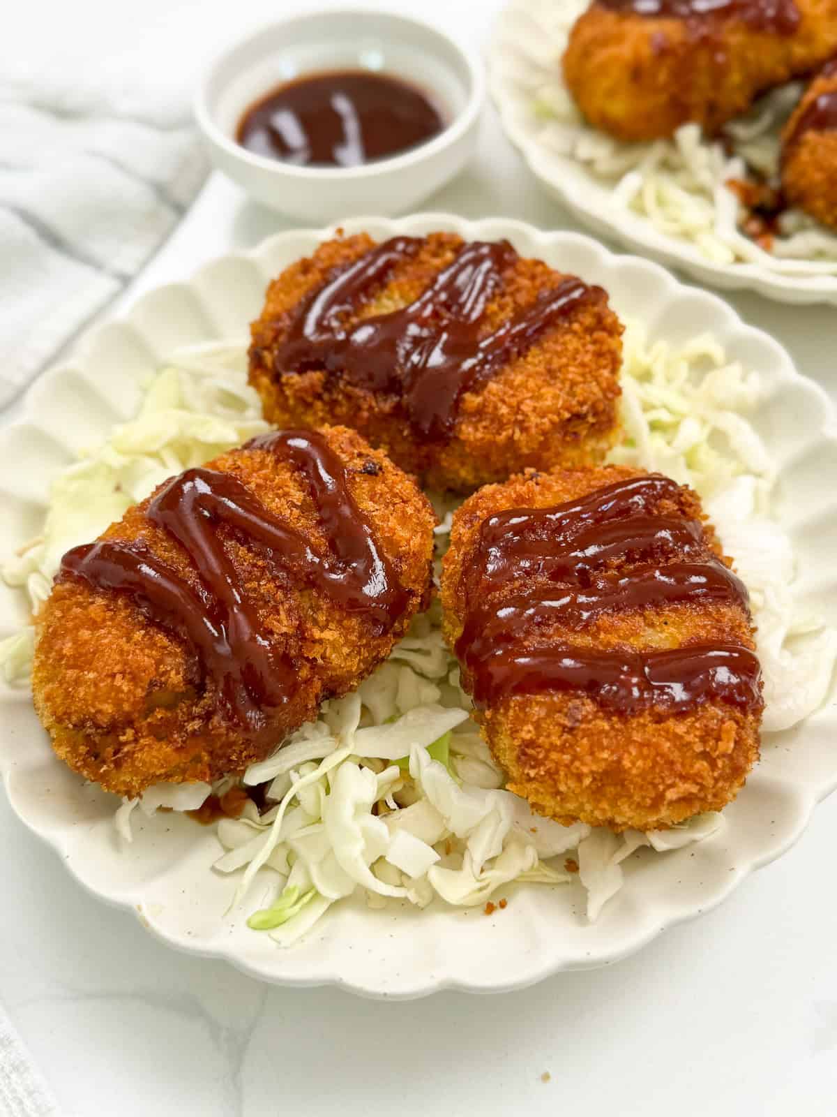 Japanese Sweet Potato Croquettes (Satsumaimo Korokke) three on a plate side view