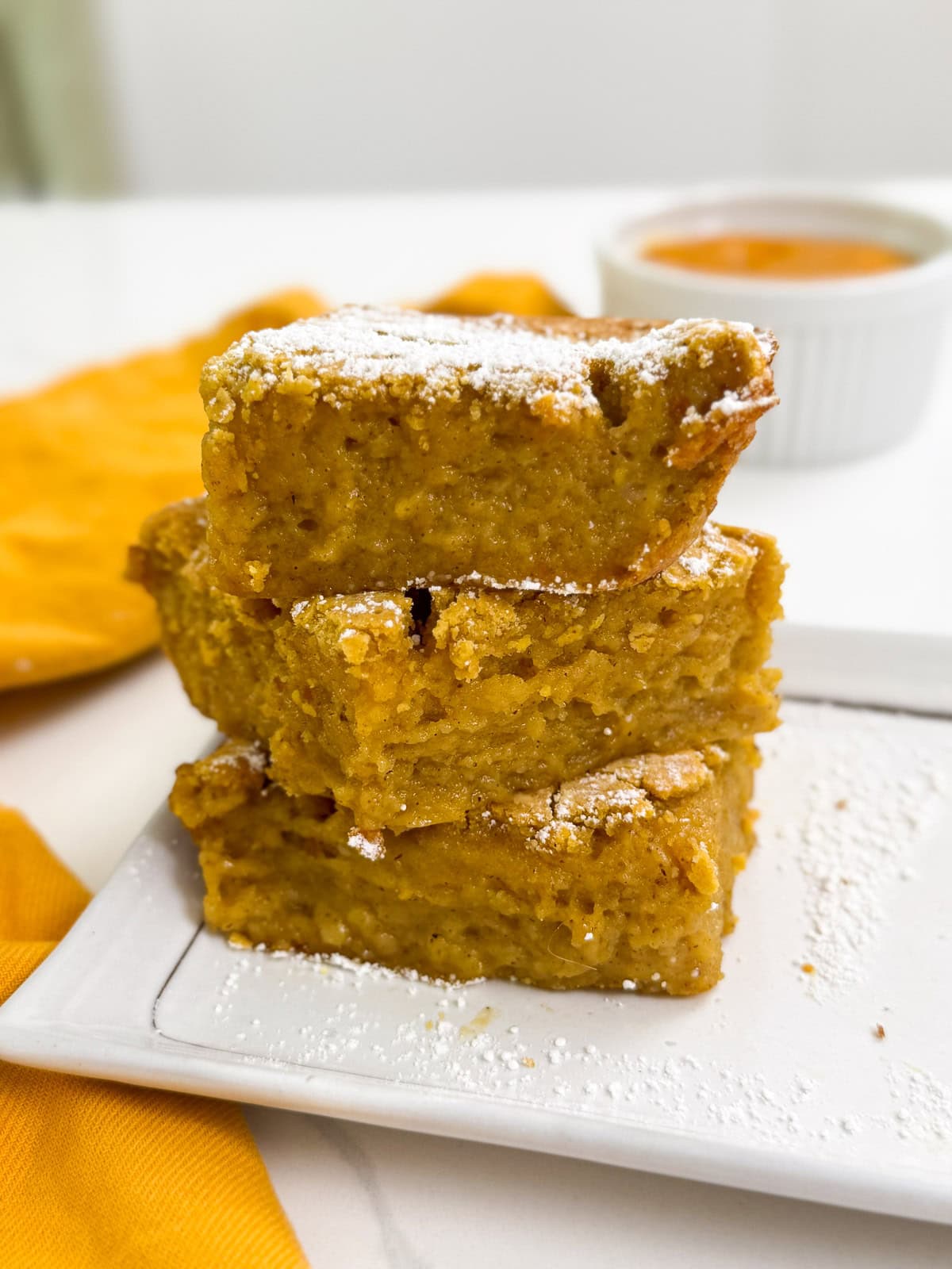 Pumpkin Butter Mochi stack on a plate side view