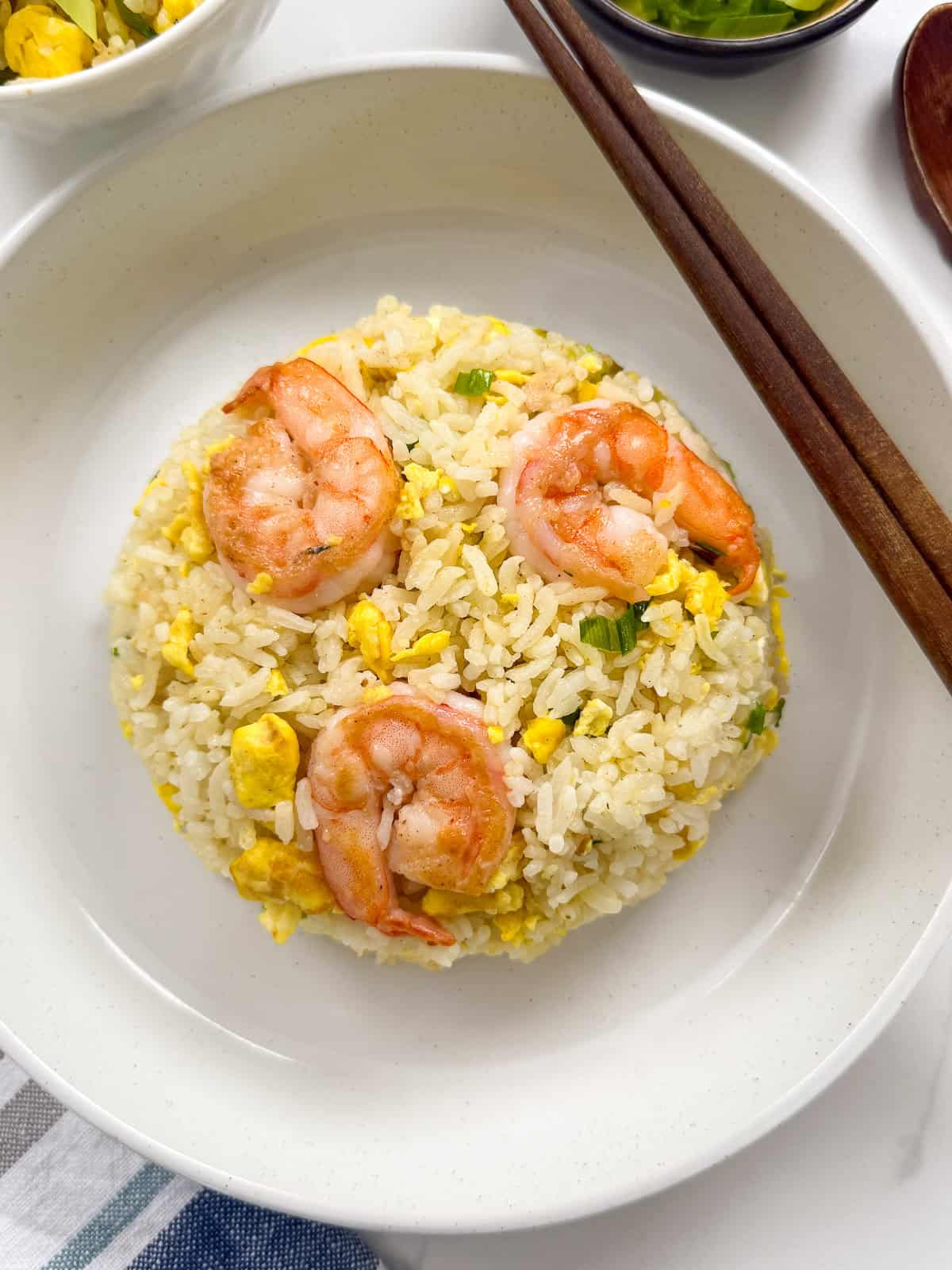 Shrimp Fried Rice on a plate with chopsticks main view