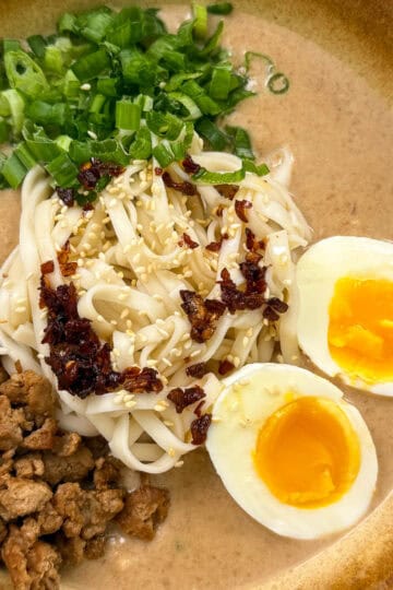 Creamy Peanut Miso Ramen with ground pork, eggs, and green onion featured view