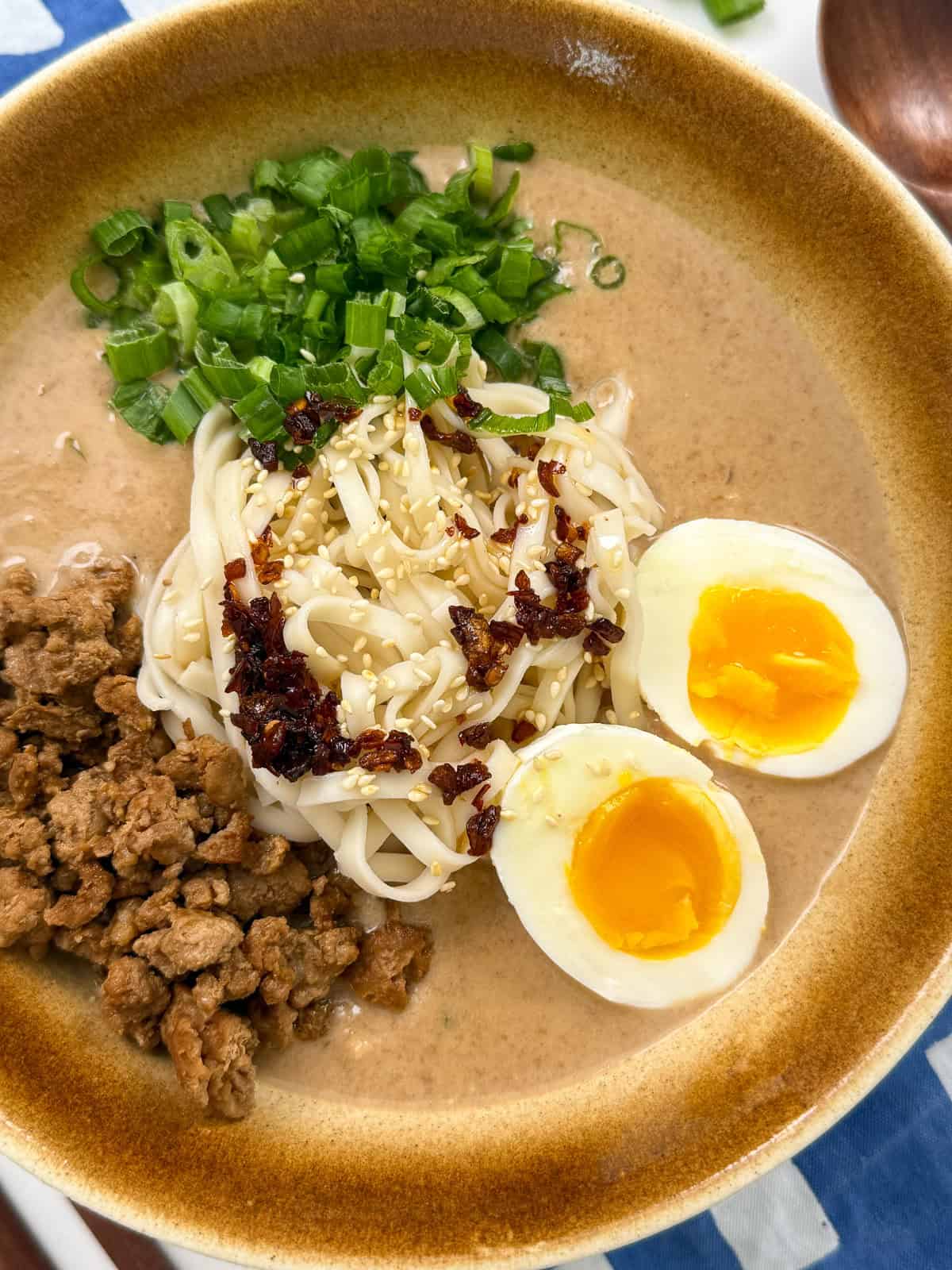 Creamy Peanut Miso Ramen with ground pork, eggs, and green onion main view
