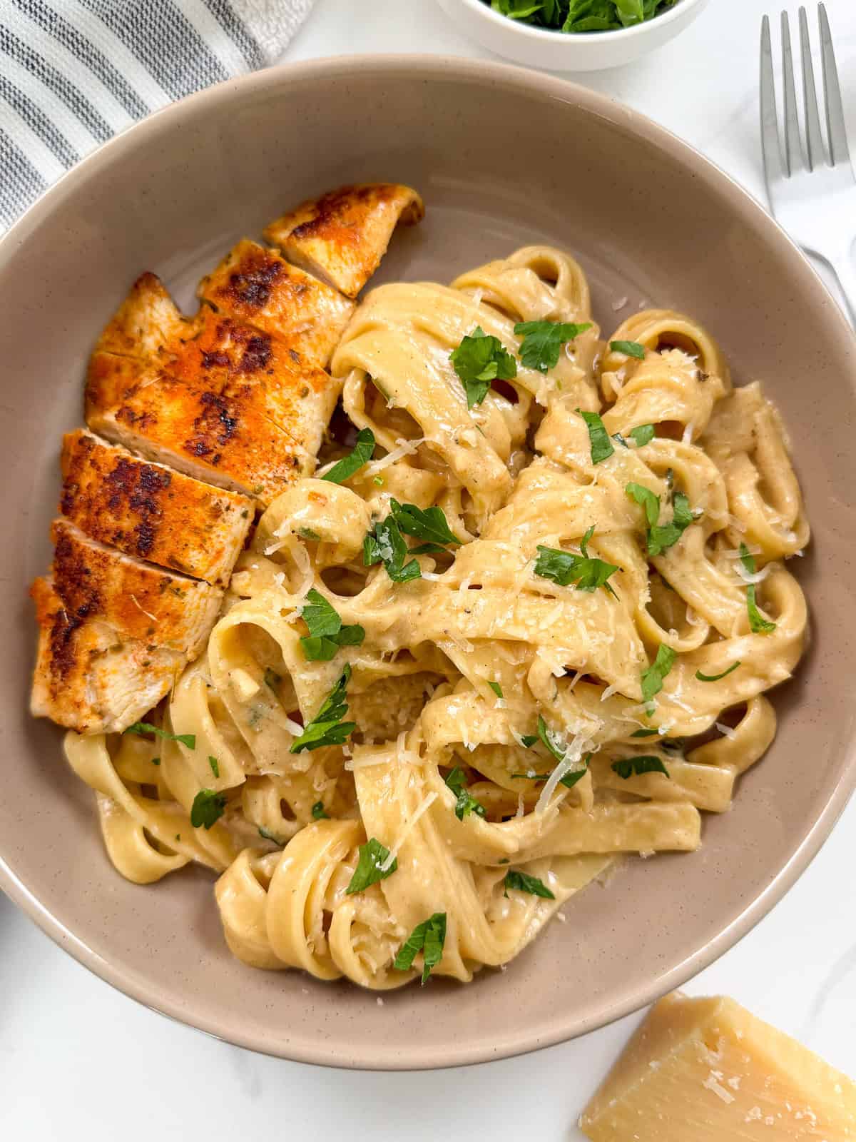 Chicken fettuccine alfredo in a bowl top down view
