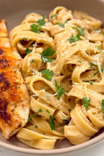 Chicken fettuccine alfredo in a bowl featured view
