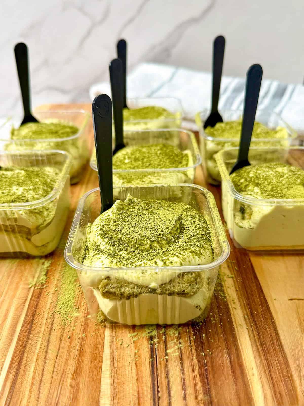 Matcha tiramisu in individual cups and spoon main view