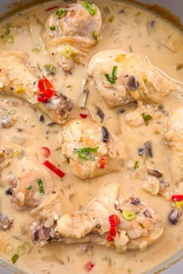 Chicken drumsticks simmered in a fragrant coconut lime broth with red chilis and green onions.