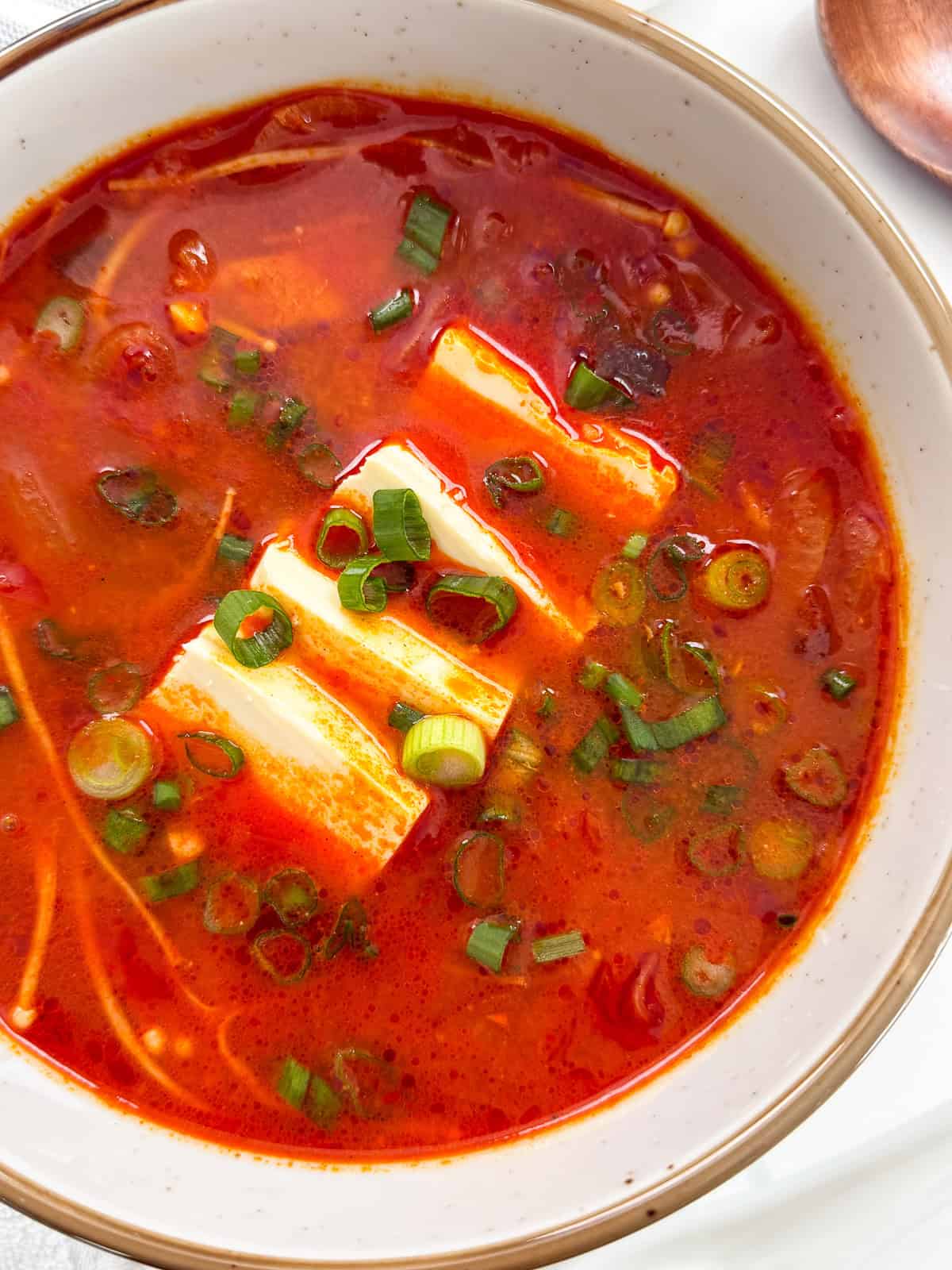 Kimchi Jjigae (Kimchi Stew) in a bowl side view